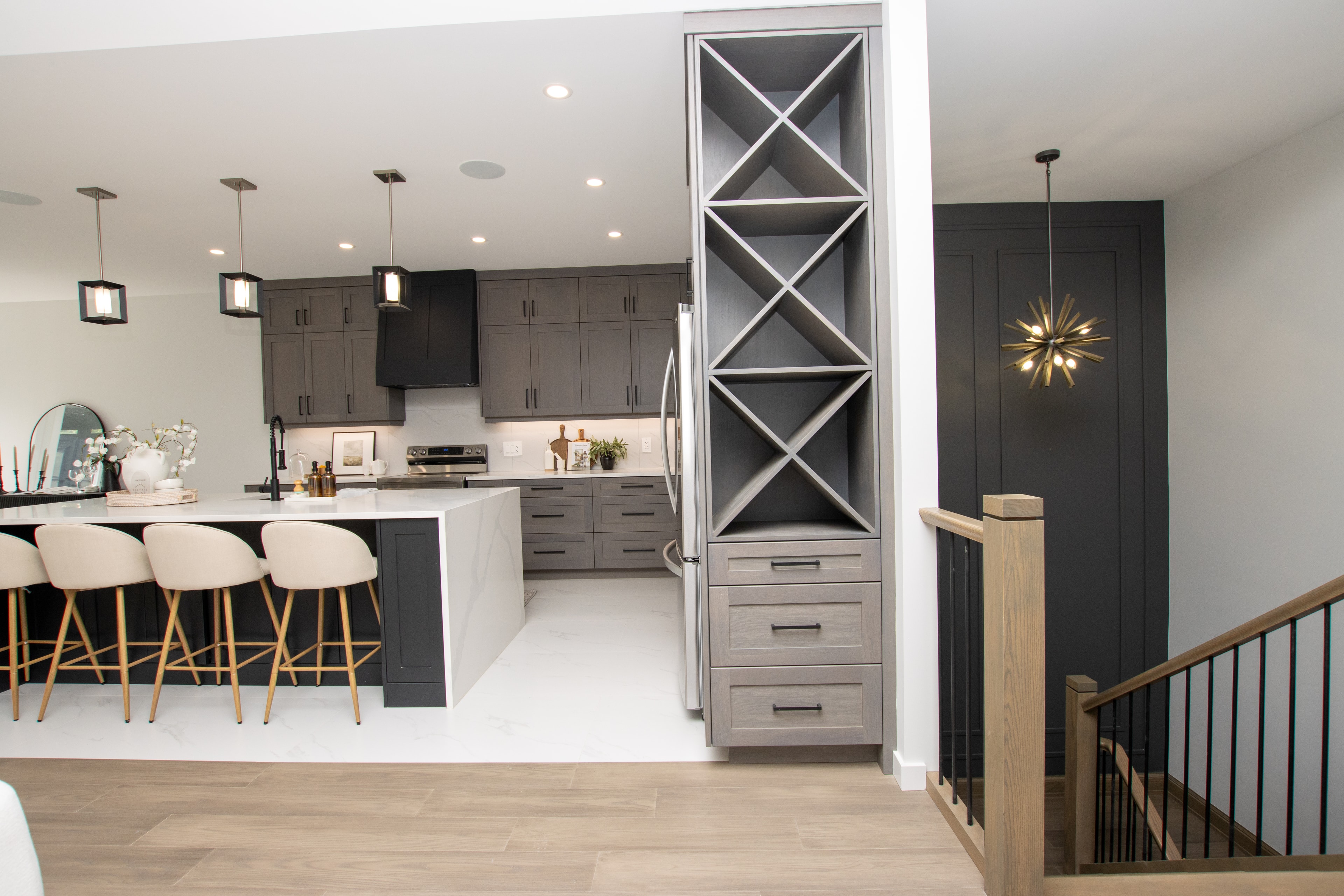 Kitchen with wine rack built-in and staircase detail